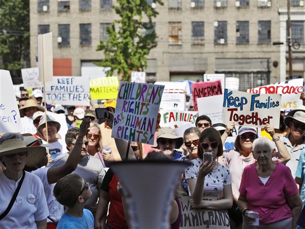 Hundreds protest immigration policies at Toledo Love Wall