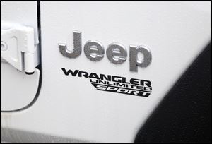 The logo on the 2018 Jeep Wrangler model at Grogan's Towne in Toledo