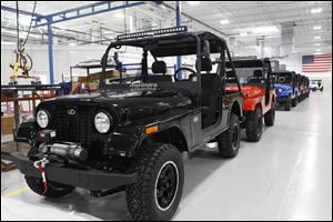 A line of Mahindra's Roxor off-road vehicles made at its plant in Auburn Hills, Mich.