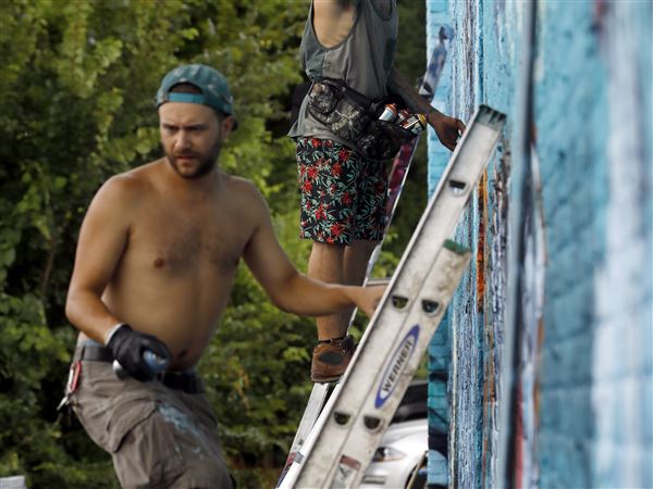 PHOTO GALLERY: Mural creation in South Toledo
