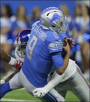 Detroit Lions quarterback Matthew Stafford is sacked by New York Giants defensive end Kerry Wynn during a preseason game Friday.