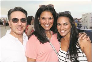 From left: Doug Adams-Arman, Hana Mourad and Charine Mourad during the 17th annual Barefoot at the Beach.
