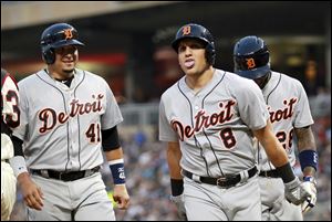 Detroit Tigers Mike Mahtook celebrates his three-run home run with teammates Victor Martinez (41) and Niko Goodrum.