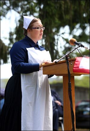Cassie Greenlee portrays Margaret Lehmann, a nurse in the Red Cross during World War I, during Living History Day in Oak Grove Cemetery in Bowling Green last year. This year's Living History Day takes place Sunday afternoon.