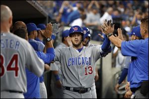 Chicago Cubs' David Bote celebrates his two-run home run against the Detroit Tigers.