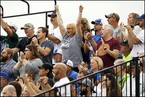 Joanie Bell, center, cheers alongside other Stryker fans.