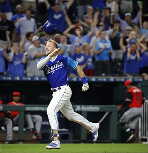 Kansas City Royals' Hunter Dozier celebrates after hitting a walk-off home run against Cody Allen of the Cleveland Indians.