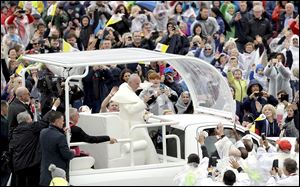 Pope Francis arrives to celebrate Mass at the Phoenix Park in Dublin, while on a two-day visit to Ireland. Lower than expected crowds greeted the Pope in the wake of the latest sex abuse scandal.