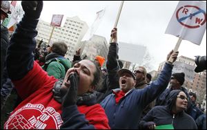 Demonstrators protest against right-to-work legislation at the Michigan State Capitol in Lansing, Michigan, Tuesday, December 11, 2012. THE BLADE/DAVE ZAPOTOSKY