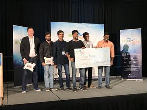 The MicroBuoy team from Wayne State University accepts its award after winning the top prize at the Erie Hack Water Innovation Summit in 2017.