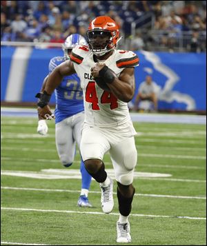 Cleveland Browns defensive end Nate Orchard returns an interception for a 64-yard touchdown against the Detroit Lions.
