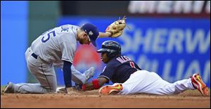Tampa Bay Rays' Brandon Lowe tags out Cleveland Indians' Greg Allen at second base.