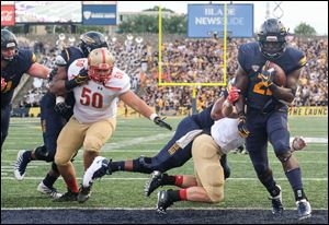 University of Toledo RB Shakif Seymour (21) scores a touchdown against VMI. The Rockets now shift their focus to No. 21 Miami (Fla.)