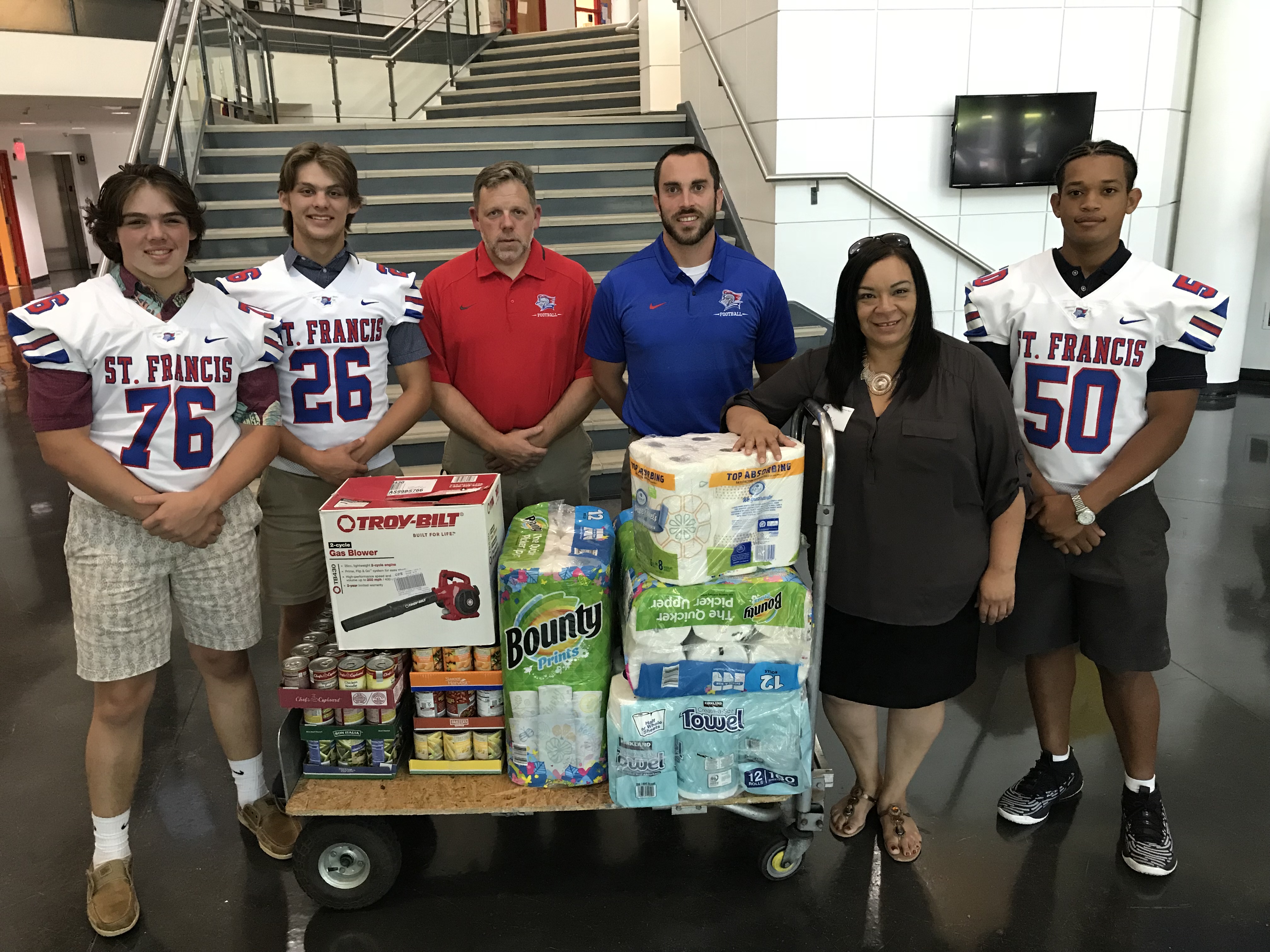 St. Francis football team donates to Mom's House The Blade