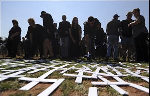 In October of 2017, people place white crosses, symbolically representing farmers killed, at the Vorrtrekker Monument in Pretoria, South Africa. U.S. President Donald Trump has tweeted that he has asked the Secretary of State Mike Pompeo to 