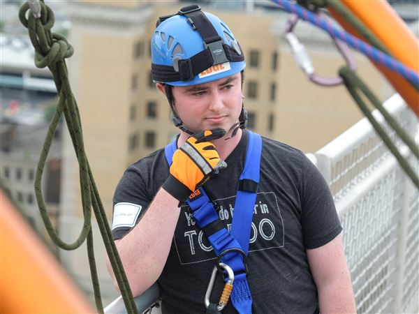 Photo Gallery: Reporter rappels during Over the Edge fund-raiser