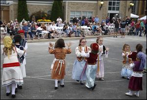 Ellinopedia Dance Group during the Toledo Greek American Festival outside the Holy Trinity Greek Orthodox Cathedral.