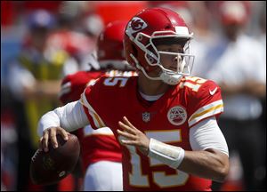 Kansas City Chiefs quarterback Patrick Mahomes passes against the Los Angeles Chargers during the first half of Sunday's opener.