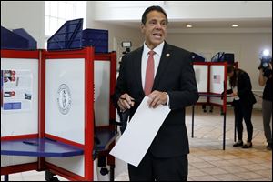 New York Gov. Andrew Cuomo speaks as he marks his primary election ballot at the Presbyterian Church of Mount Kisco, in Mount Kisco, N.Y.