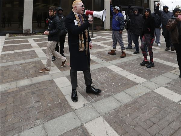 Activist pleads not guilty after arrest at council meeting