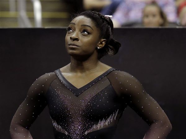 Brother of Olympic gymnast Simone Biles charged in Cleveland triple slaying