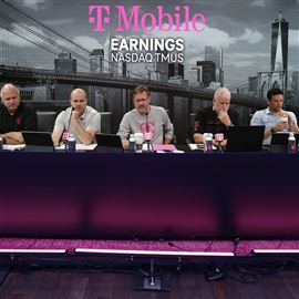 T-Mobile CEO Mike Sievert, center, answers caller's questions during the T-Mobile Q2 2022 earnings' call, July 27, in New York.