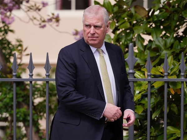 Prince Andrew looks round as he leaves after attending the Easter Matins Service at St. George's Chapel, Windsor Castle on April 20.