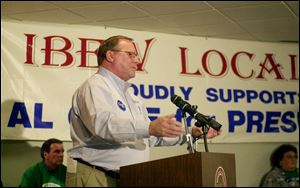 Ohio AFL-CIO President Bill Burga tells the rally in Rossford that union turnout can swing the vote.