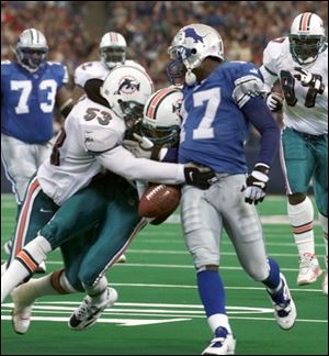 Lions receiver Larry Foster fumbles near the end zone during the second quarter yesterday. Miami recovered for a touchback.