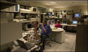 Owens Corning's tech center monitors a network of PCs. The company is bucking a trend toward keeping hardware longer.