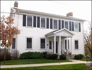 The house at Conant and East Harrison is circa 1825.