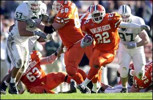 Tailback Joe Alls finds some daylight through the Bobcats' line and snakes 34 yards for the Falcons' second touchdown.