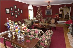 The living room of the Valko-Moore home is decorated with a collection of Christopher Radko finials and reindeer candlesticks.