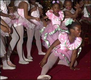 Clockwise from bottom, Chantonique Hollins, Tia Campbell, and Linda Darden enjoy their performances in Redeemer Lutheran Church.