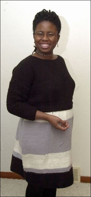 Melissa Jeter, an enthusiastic knitter, models one of the dresses she made.