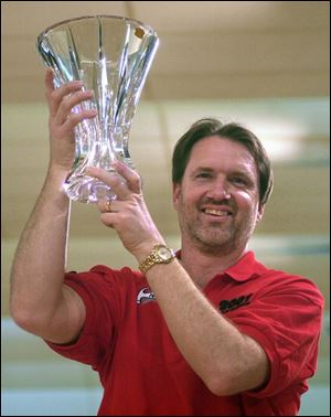 Symbolic of the Glass City, Walter Ray Williams Jr. hoists the PBA National Championship trophy. It is his third major title.