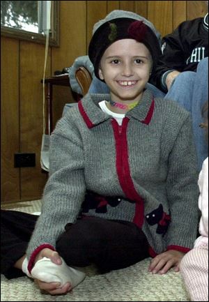 Brain-cancer victim Ashleigh Lowe, 8, `always had a smile on her face,' an aunt says.