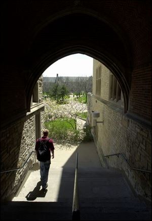 ROV UT 042501 1  April 25, 2001--A student leaves University Hall and into a bright, sunny day Wednesday at the University of Toledo. Blade photo by Andy Morrison