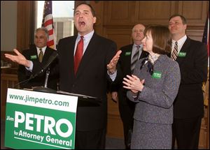 Jim Petro, second from left, announces his run for attorney general in the Lucas County Courthouse. With him, from left, are Hancock County Auditor Anthony Iriti, Lucas County GOP Chairman Patrick Kriner, Mr. Petro's wife, Nancy, and House Speaker Larry Householder.
