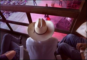 Spectators with backstage passes have a bird's eye view of performers at Country Concert 2001 in Fort Loramie.