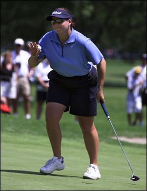 Moira Dunn acknowledges the applause from the gallery after her birdie on the fourth hole yesterday dropped her to 9-under-par for the tournament. She finished tied for fifth at 10-under 274. It was her best finish of the season. `I hit it good this week,' Dunn said.
