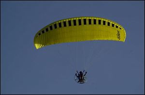Don Jordan of Indiana takes to the skies over Perrysburg Township with his paraglider.