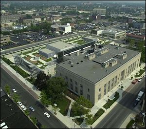 The Main Library's downtown campus features the refurbished Art Deco structure that fronts Michigan Street, bottom right, and the new addition, which extends between Madison Avenue, left, to Adams Street.