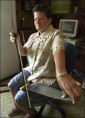`I like challenges. I'm always looking to try something new,' says Betty Kasubski, with her musical saw. Among her other interests, Miss Kasubski, 48, makes bereavement calls for two hospices, Heartland and Visiting Nurse, and stays on call for a 24-hour crisis hotline.