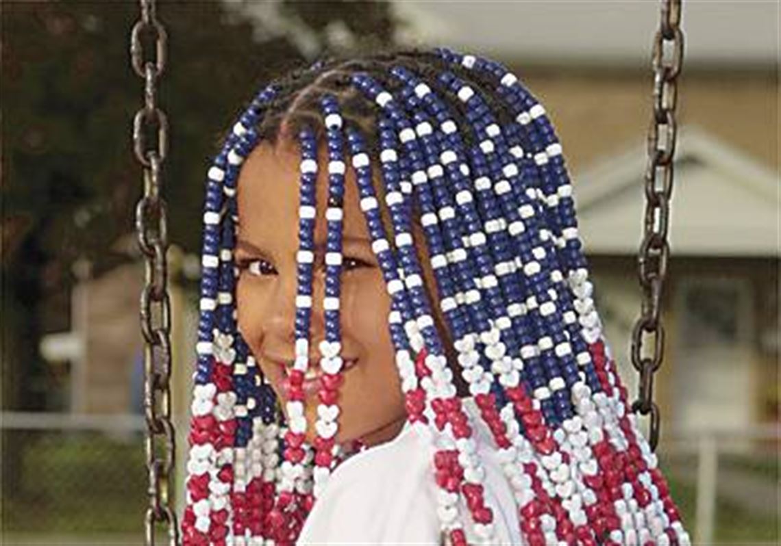 Old Glory waves in girl's braids