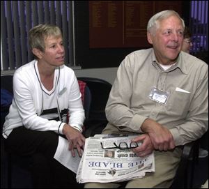 Kay and James Delphi, of Perrysburg, relax in the Nomads terminal before leaving on a trip with the travel club. 