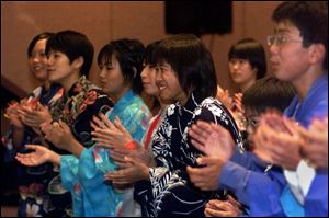 cty kids10p October 9, 2001. Twenty three 7th and eighth graders from Toyohashi Japan sing songs Tuesday night at the Wyndam Hotel. blade photo by Jeremy Wadsworth
