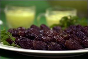 Dates are eaten to break the fast, and Mango Lassi, background, is a favorite in Pakistan.