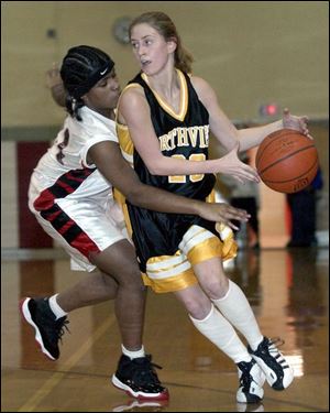 Rogers' Vivica Jackson knocks the ball from Northview's Lauren Amstutz during the first quarter.