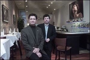 Eric Hillenbrand, left, and his business partner, James Zaleski, have refurbished a dozen downtown buildings, including Diva restaurant.
